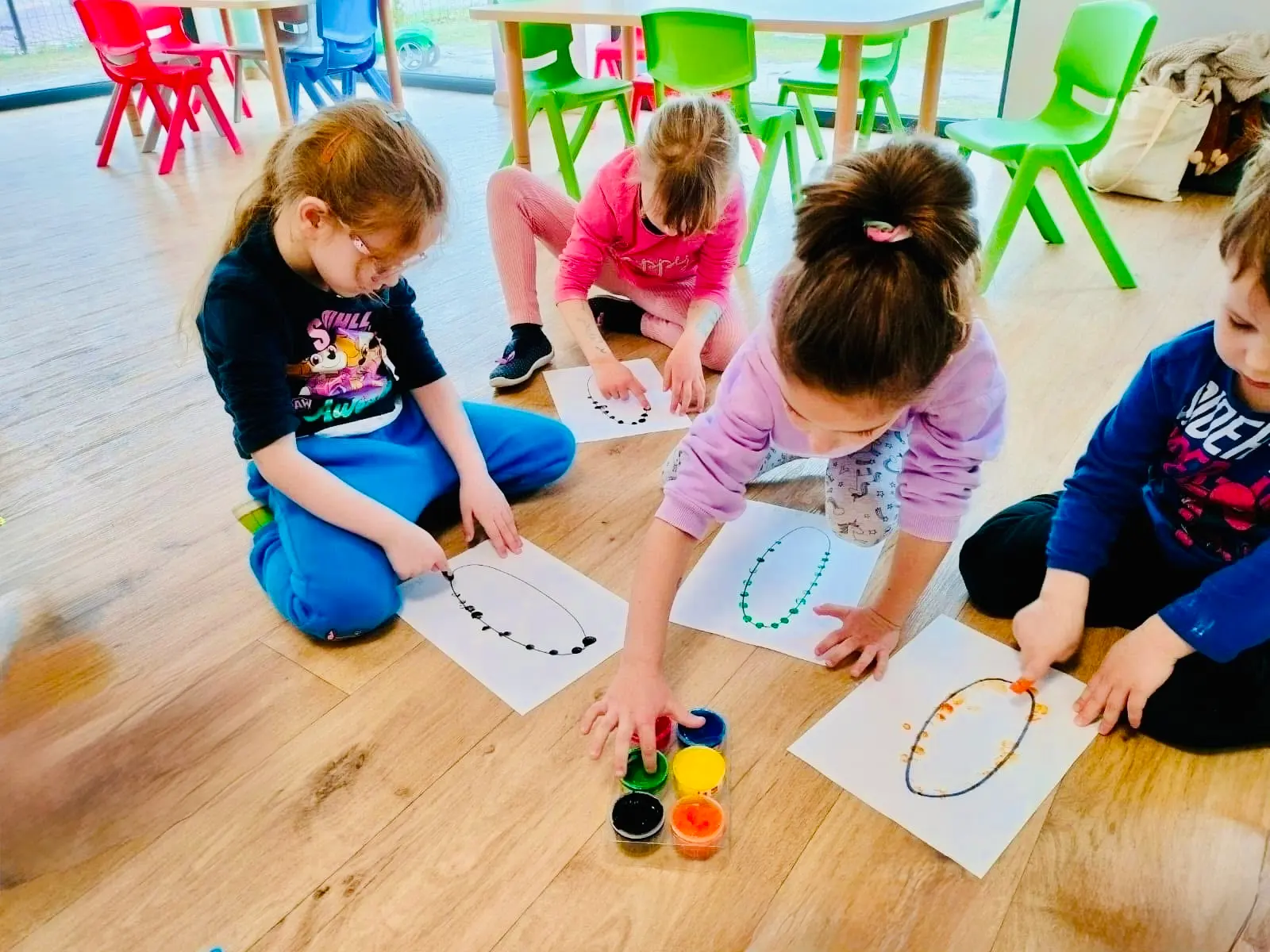 Children enjoying art activities at Poliglotek
